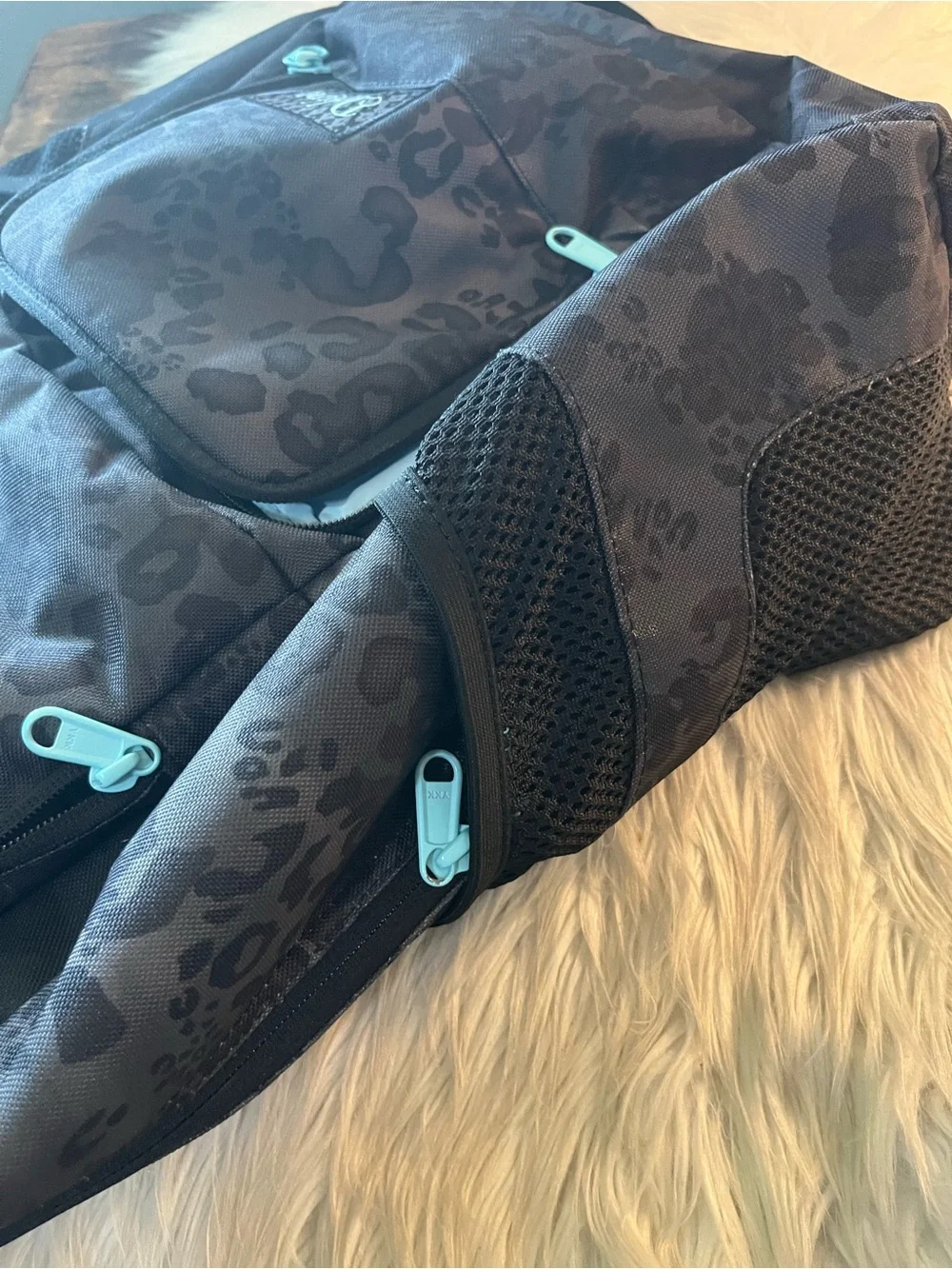 Dakine Black Leopard-Print Backpack with Teal Zipper Accents